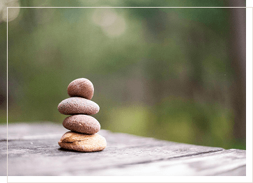 small stack of stones in Zen meditation style with simple offset frame
